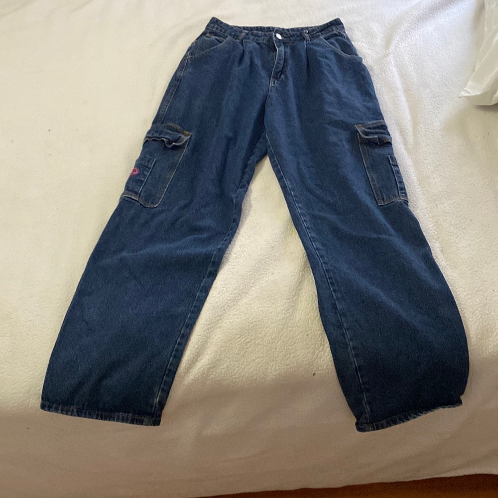 Large dark blue women’s cargo jeans.